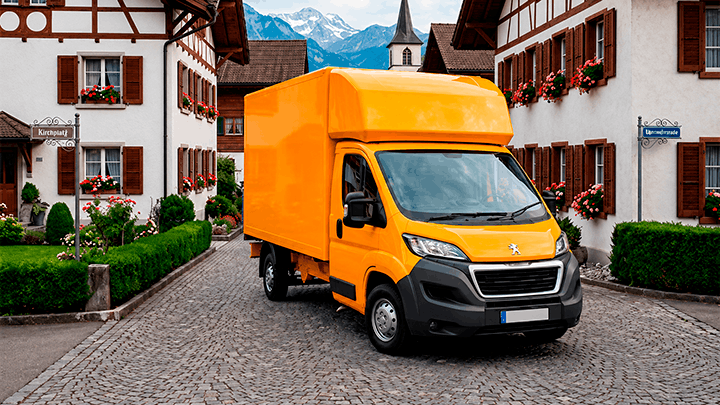 A GroWrk delivery van arriving in a Swiss village street